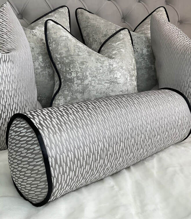16″ X 6″ ASTRID BOLSTER CUSHION / CONTRASTING BLACK PIPING