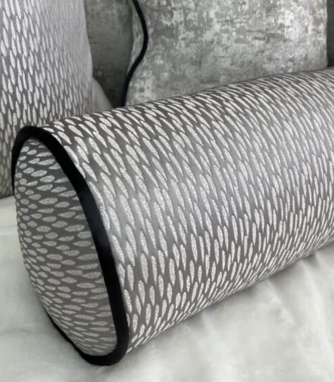 16″ X 6″ ASTRID BOLSTER CUSHION / CONTRASTING BLACK PIPING