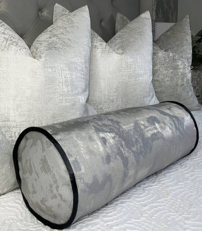 16″ X 6″ PEWTER PIPED BOLSTER CUSHION IN METALLIC GREY