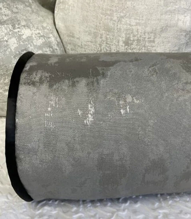 16″ X 6″ PEWTER PIPED BOLSTER CUSHION IN METALLIC GREY