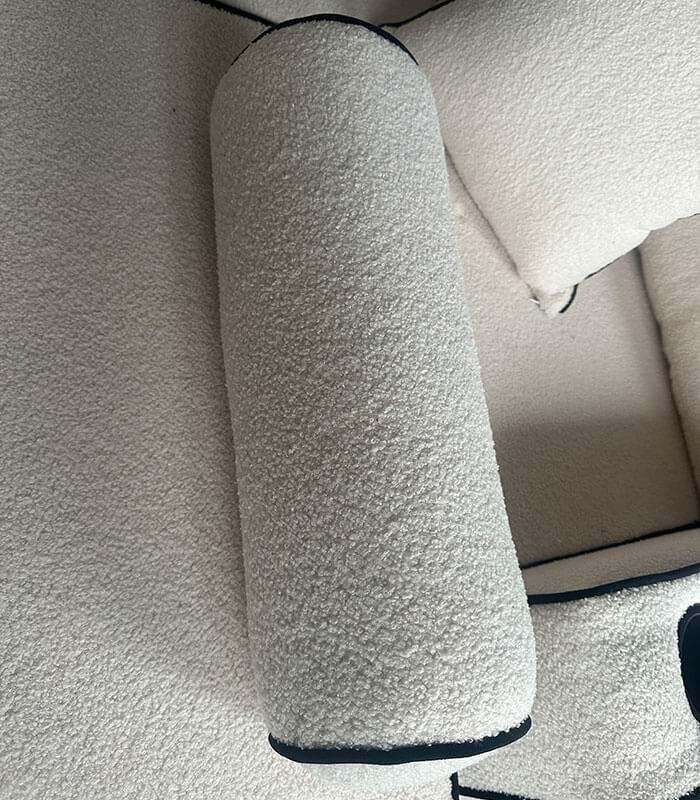 Boucle fabric bolster cushion with contrast piping