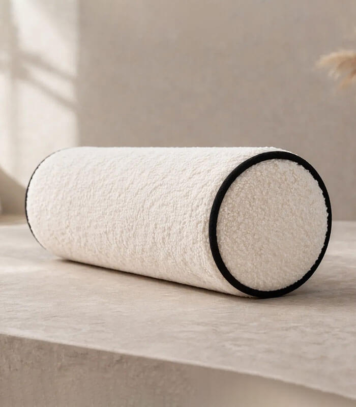 Boucle fabric bolster cushion with contrast piping