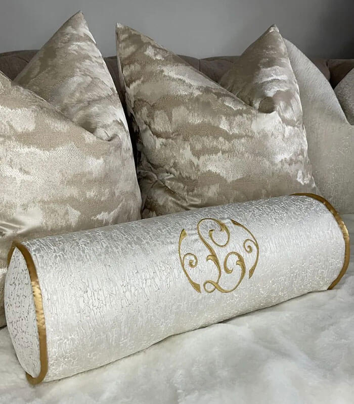 PERSONALISED EMBROIDERED BOLSTER CUSHION 16″ X 6″ IVORY CONTRASTING GOLD PIPING